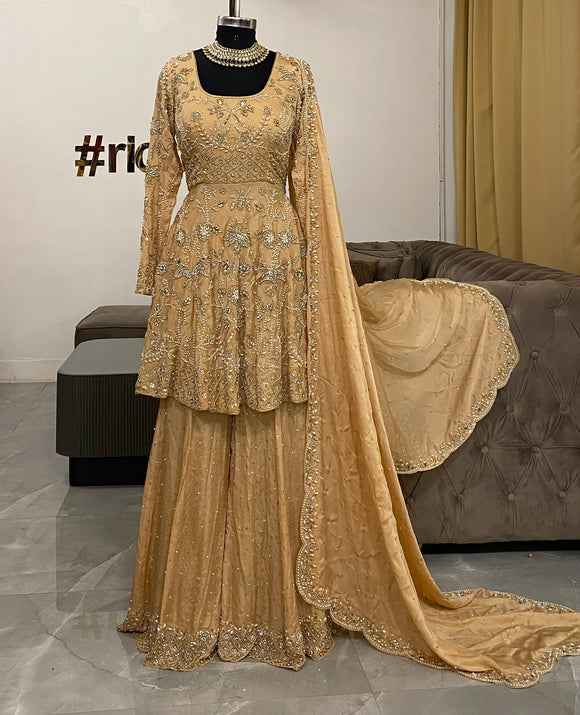 Gold peplum sharara with intricate silver embroidery