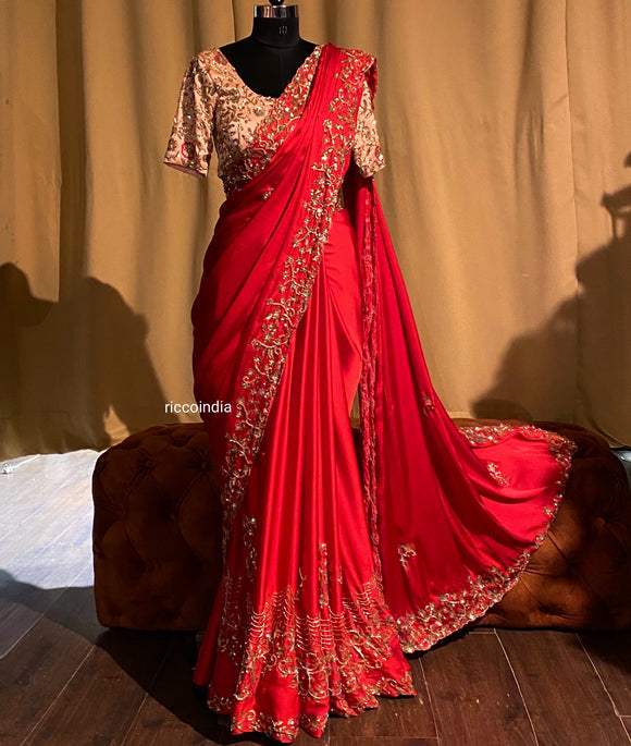 Red crepe saree with peach blouse