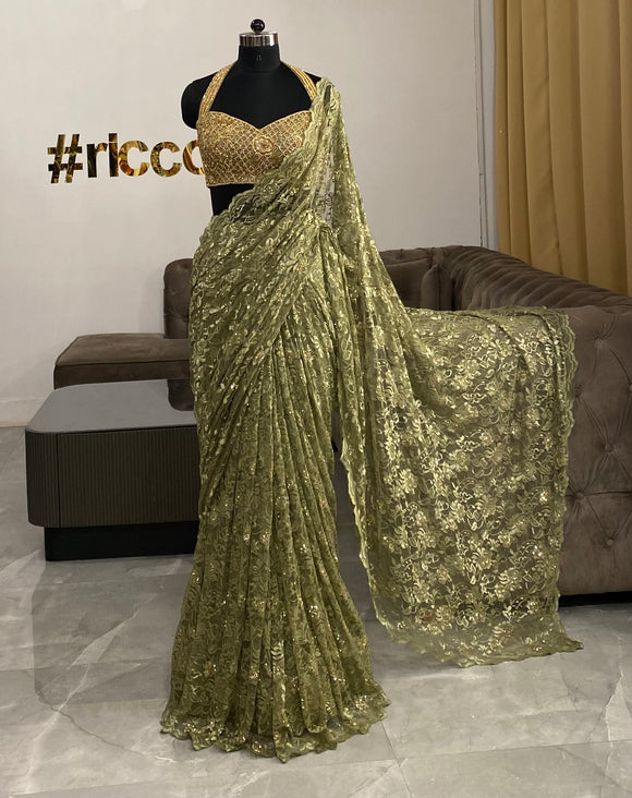 Sage green lace embroidered saree with a beaded corset top