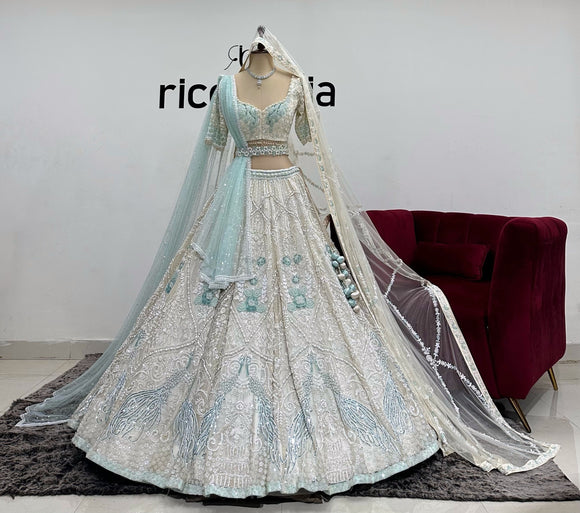 IVORY LEHENGA WITH TIFANNY BLUE HINTS