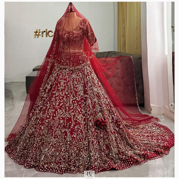 DEEP RED TRAIN LEHENGA WITH CATHEDRAL STYLE VEIL