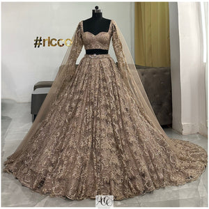 DARK GOLD TRAIN LEHENGA WITH SHOULDER CAPES