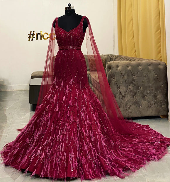 Wine mermaid gown with feathers & removable capes Ricco India Wine mermaid gown with feathers & removable capes Ricco India