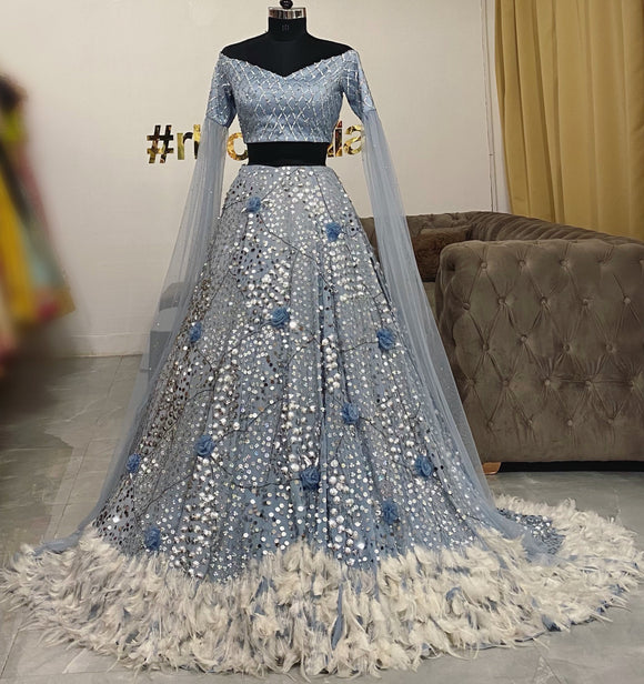 Blue crop-top with train feather skirt