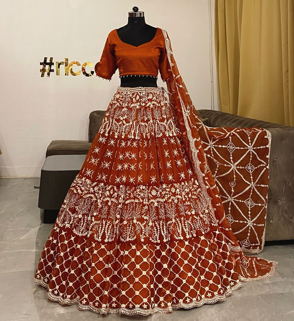 Orange lehenga with white dori work