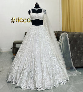 White lehenga with beaded top