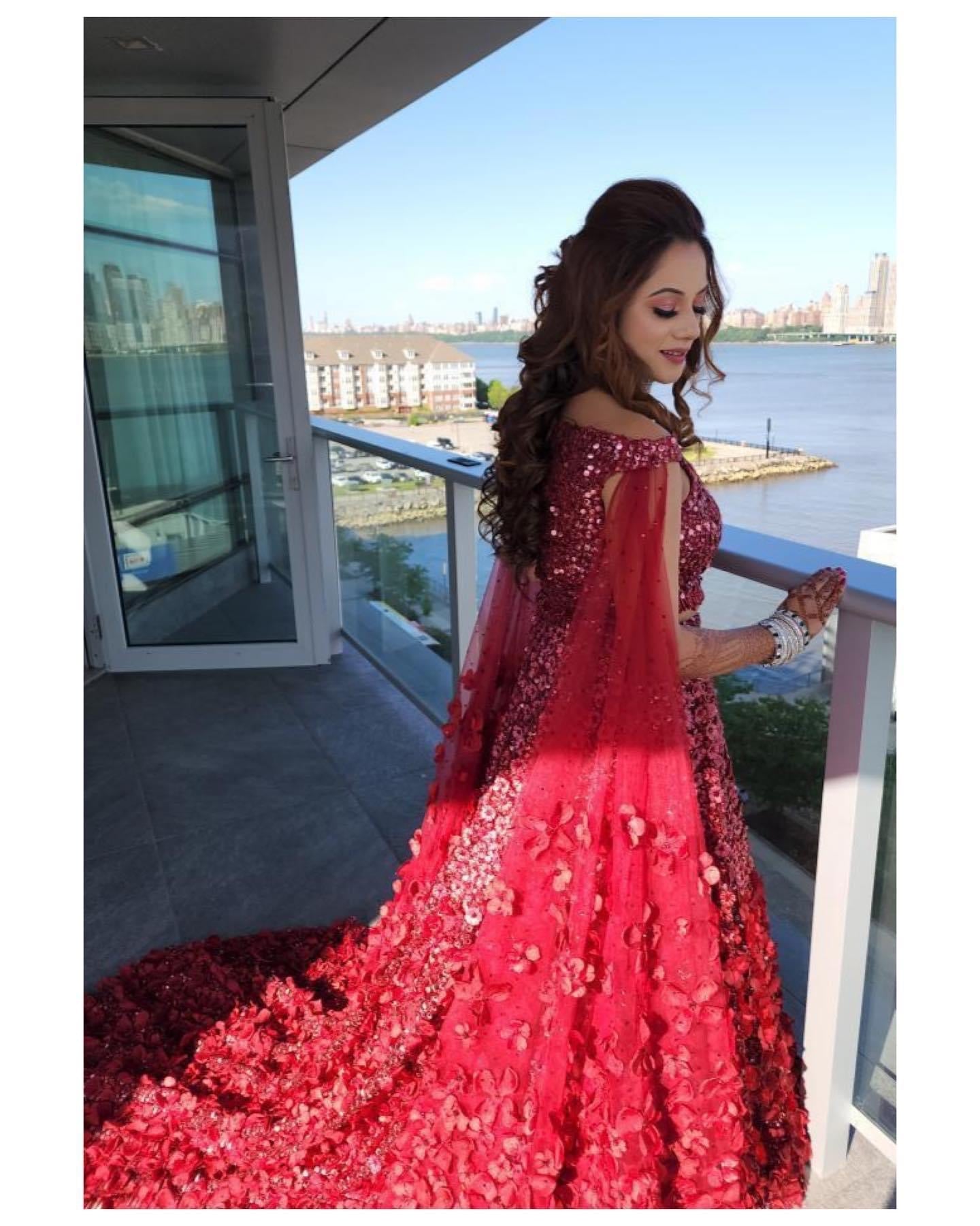 Flowery Red bridal lehenga with trail