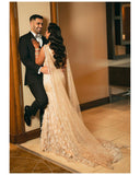 Mermaid trail gown with feathers and shoulder capes