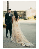 Mermaid trail gown with feathers and shoulder capes