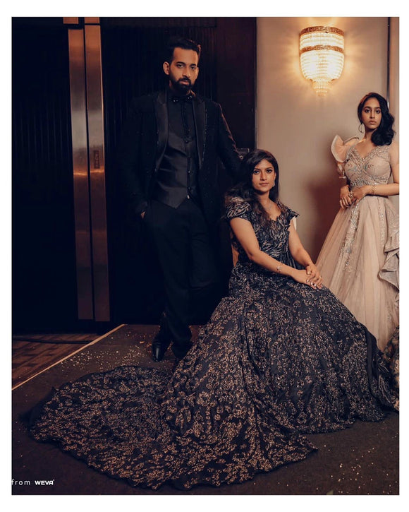 Charcoal blue train gown with shoulder cape