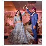 Grey structured lehenga with shoulder capes