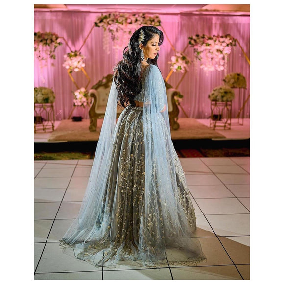 Grey structured lehenga with shoulder capes