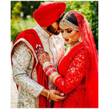 Red Anarkali gown with trail