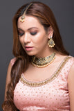 Gold necklace with black stones and pearls