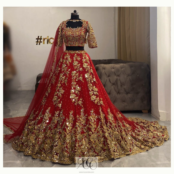 Red train bridal Lehenga with dori work and mirror embellishment