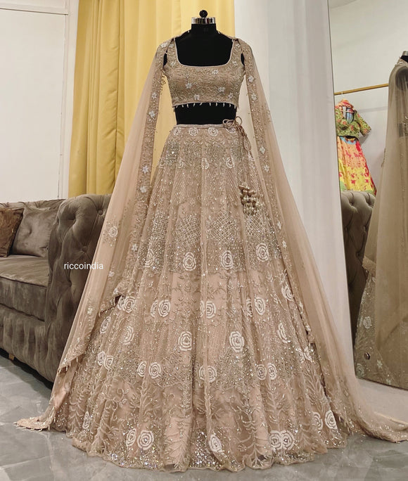 Champagne gold lehenga with pearls and Swarovski embroidery