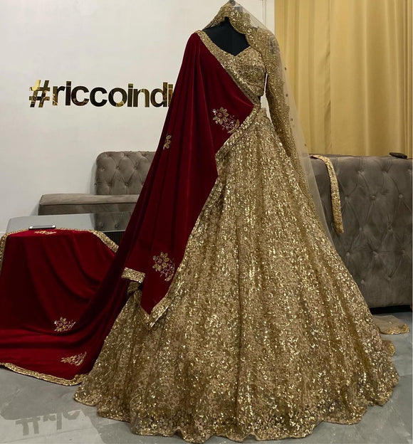 Gold flared lehenga with red shawl and curved border dupatta