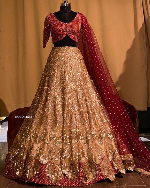 Gold sequin work layered lehenga with maroon top and dupatta