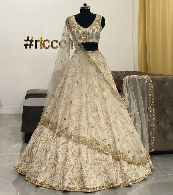 Ivory jacquard lehenga with pearls embroidery and cut work dupatta