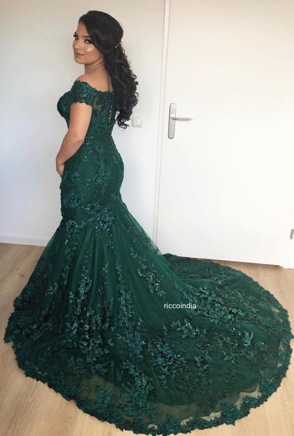 Emerald green train gown with glass beads and pearl embroidery