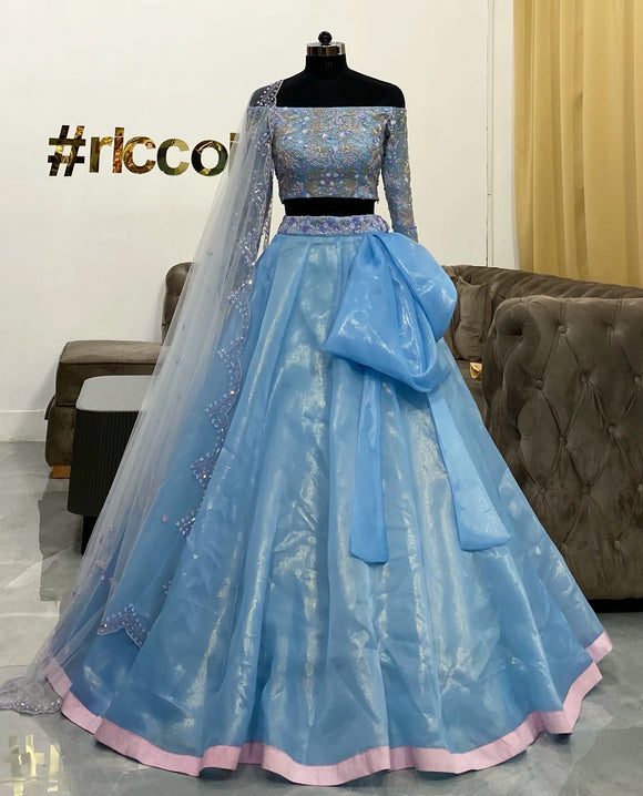 Pastel blue bow lehenga with curved dupatta