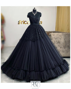 Fluffy black gown with black beadwork and crystal drops