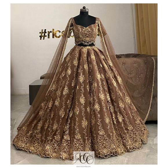 Chocolate brown train lehenga with shoulder capes