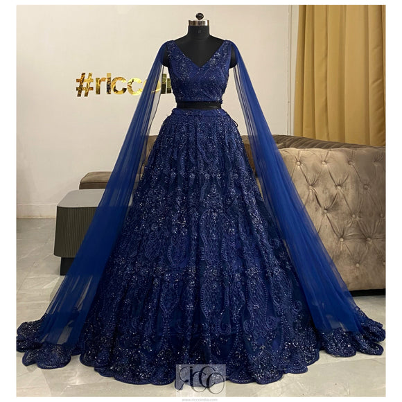 Navy blue shoulder capes Lehenga with heavy blue beading