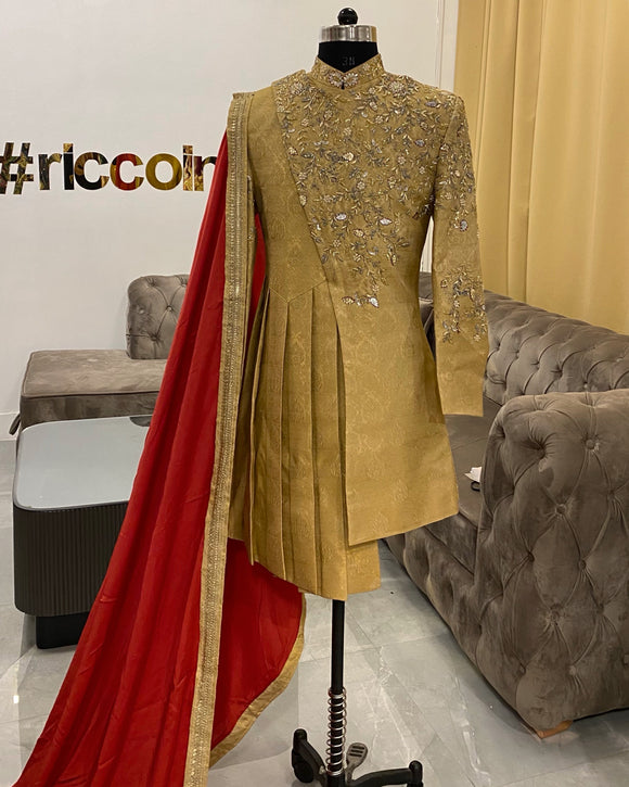 Draped sherwani in gold with red shawl