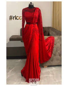 Red stitched saree with a corset top and beaded belt