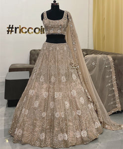 Champagne gold lehenga with pearls and Swarovski embroidery