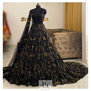 Black train lehenga with corset beaded top and gold embroidery skirt