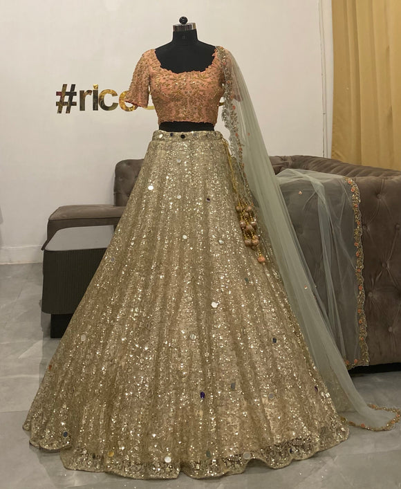 Gold sparkle Lehenga with peach top and mint dupatta