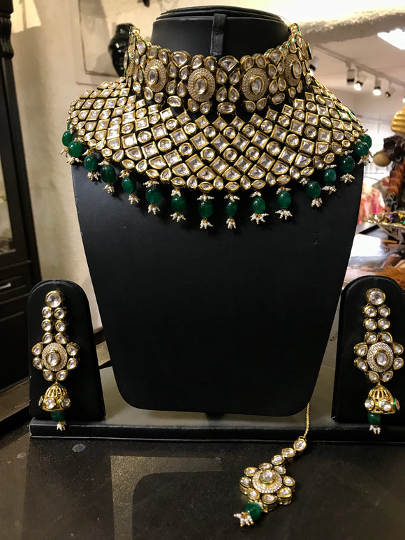 Pure polki necklace with emerald stones
