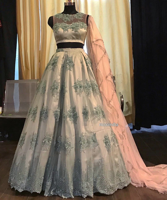 Mint blue lehenga with glass bead embroidery and grilled peach dupatta