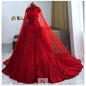Red train lehenga with a lace embroidery veil