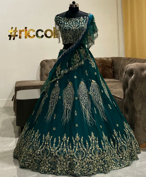 Green lehenga with peacock embroidery and modern draped dupatta Ricco India Green lehenga with peacock embroidery and modern draped dupatta Ricco India
