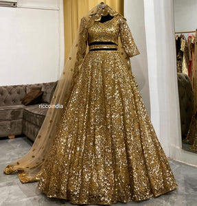 Gold sequins work lehenga with curved dupatta