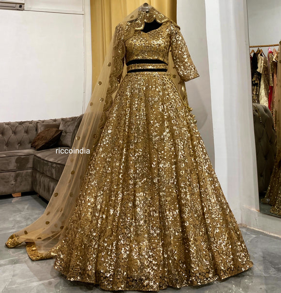 Gold sequins work lehenga with curved dupatta