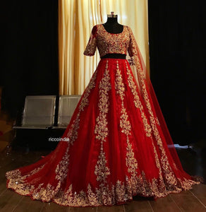 Red dori work lehenga with train.